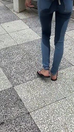 Public Wetting Jeans in Park Near the Beach