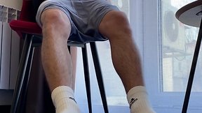 Man with hairy legs in white adidas socks jerking off penis