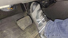 Driving in green barefoot sneaker
