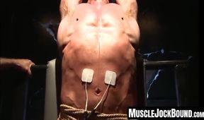 Captivator secures painful electrodes in his captive's stomach