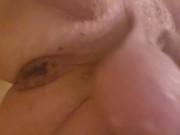 Stretching my cunt with my inflatable plug in the shower.