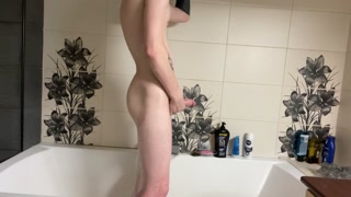 TATTOOED GUY JERKS OFF A HUGE COCK IN THE BATHROOM AND CUMS