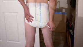 Huge diaper enema in a white diaper that quickly turns brown! Before I know it the diaper leaks!