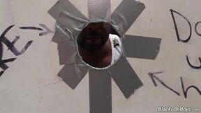 Bearded guy sucks a ebony cock at a gloryhole