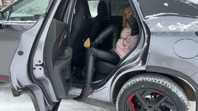 girl in high-heeled boots went for a walk on the lake, but can’t get out, her heels slip on the snowy mountain