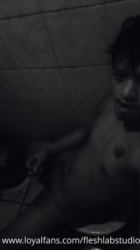 Tattooed Pinoy Twink Jerks Off in Dark Toilet, Plays Nipples, Shoots on Big Balls