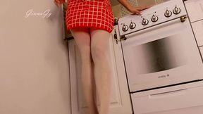 Hot housewife sexually rustles her apron in the kitchen