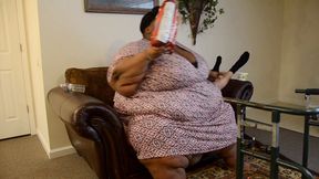 Mz Fluff snacks on her human sofa