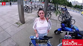 Tattooed German MILF Adrienne Kiss takes a big load in her mouth on a public fuck date