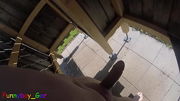I jerk off my big cock naked in a very public changing room on the lawn at the outdoor pool and squirt my cream onto my swimming trunks.