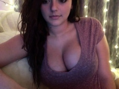 Busty curly brunette with big boobs fucks on couch