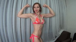 Muscles posing in bright bikini BI