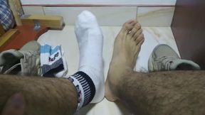 Sweat-Sopping white socks and nude feet after a long day