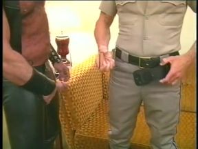 Muscular horny bear in leather chaps gets his cock slurped by police