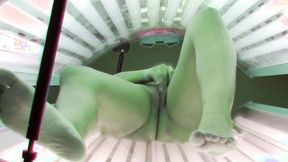 ”Bombshell Brunette Masturbating in Solarium”