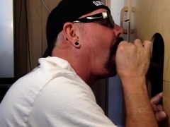 Horny DILF cocksucking BBC in gloryhole