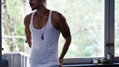 Athletic stud with chiseled muscles teases during a steamy photoshoot