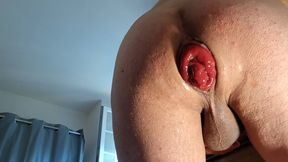 naked in front of the camera, he exposes his ass