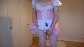 Strawberry blonde in pink costume and bra