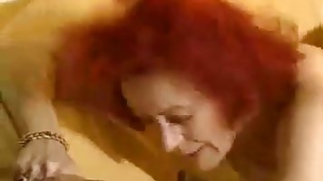 Mature redhead slut gets fucked by young guy