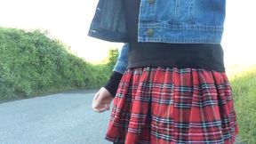 Minx in denim jacket and tartan skirt