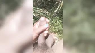 Indian guy jerks off outdoors in a field