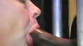 Big black dick gets suked through the gloryhole