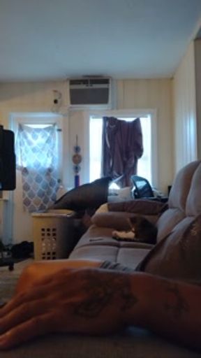 Pretty girl smokes in night dress on the couch part 1