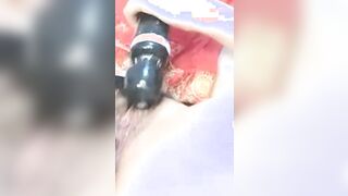 Rubs the clit with a dildo until orgasm