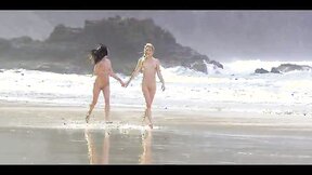 Sexy babes Mila Dark and Rosea Nubiles walking naked in the ocean waves