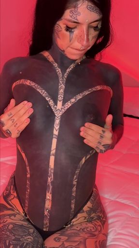 Tattooed model in body paint