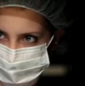 Lesbian patient in operating room with doctors