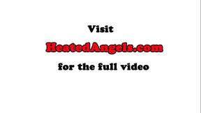 Busty inked babe poses during photo shooting