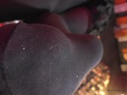 Legs in black opaque pantyhose