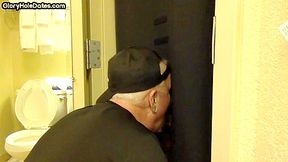 Gloryhole BJ DILF sucks cock with eager mouth near toilet