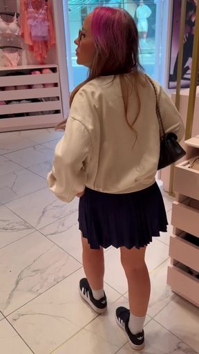 Sexy girl in skirt with ankle socks, sneakers, glasses