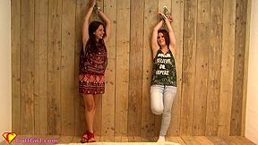 Two Girls Cuffed To A Wall