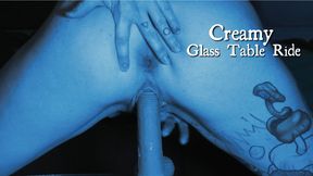 Creamy Ride on a Glass Table