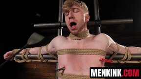 Kyler Drake makes Jesse Stone bite a gag as he drips hot wax over him