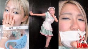 Noel Yukine, wearing a mask, picks her nose with two koyoris to make herself sneeze