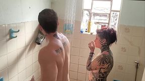 Tattooed GF gives wet blowjob in the shower