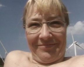 Mature Blonde Masturbates in a Field