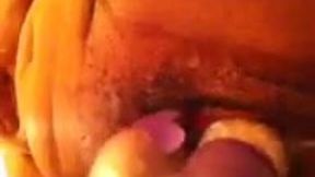 Wife's makes herself wet by poking her hairy muff with dildo