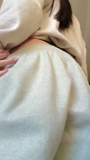 Blonde woman in white sweatpants