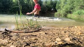 Slow motion jumping in lake in clothes. wet and fun