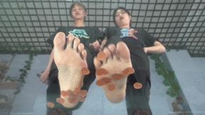 Two goddesses with beautiful feet tempting to step on gummies!