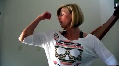 Muscular blonde MILF flexes and flashes huge fake tits during solo webcam show