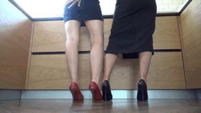 M Two air hostess who are girlfriends playing footsie in heels SHpl
