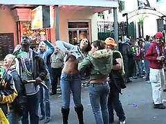 Admirable girls are flashing their sweet titties on the crowded street