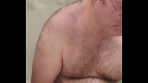 Nude Martin Lavall&eacute_e compares his small black chastity device with his 10 inch dildo